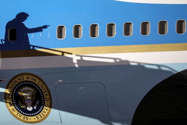 The shadow of U.S. President Donald Trump casts on Air Force One as he arrives for a campaign rally at Duluth International Airport in Duluth, Minnesota, U.S., September 30, 2020. (Photo by Leah Millis/Reuters)