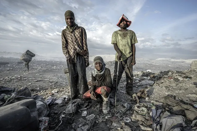 In a 200-acre-plus dump 5 kilometers north of Haiti’s capital, Port-au-Prince, hundreds of men, women and children scavenge day and night through the burning wasteland. They earn $12 to $15 a day – on a good day – for recycling plastics as well as clothing, household items and aluminum (for smelting). Some 5,000 tons of waste is created each day in the Port-au-Prince area. (Photo and caption by Giles Clarke/Getty Images Reportage)