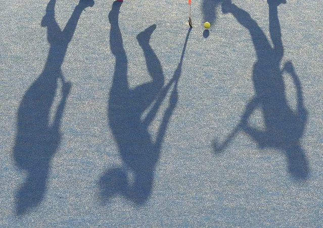The shadows of Scotland and Belgium players on the pitch during the  EuroHockey 2015 women's match at the Lee Valley Hockey Centre, Queen Elizabeth Olympic Park in London, Britain, 28 August 2015. (Photo by Hannah Mckay/EPA)