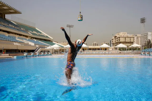 Egyptian swimmer, Omar Sayed Shaaban, 21, who has broken the record for the highest out-of-water jump while wearing a monofin, trains with his monofin at Cairo Stadium Swimming Pools, Egypt, March 20, 2021. (Photo by Hayam Adel/Reuters)