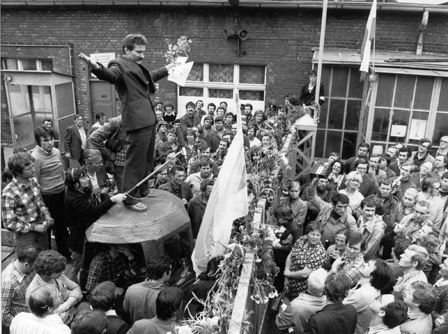 In this August 26, 1980 file photo, Lech Walesa, head of the striking workers delegation, stands on a makeshift podium as he addresses striking workers, at the Lenin shipyard in Gdansk, Poland. Poland on Monday, Aug. 31, 2020 celebrated 40 years since it took a crucial step toward democracy with the creation of the Soviet bloc's first free trade union, Solidarity, which changed the course of the nation's history. (Photo by Reportagebild via AP Photo)