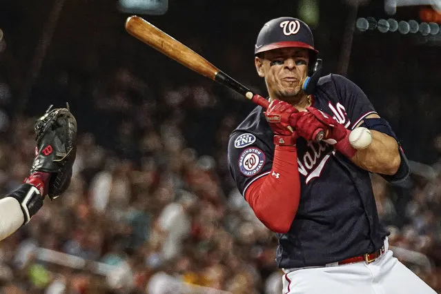 Washington Nationals' Joey Meneses is hit by a pitch during the ninth inning of the team's baseball game against the Boston Red Sox at Nationals Park, Wednesday, August 16, 2023, in Washington. (Photo by Andrew Harnik/AP Photo)