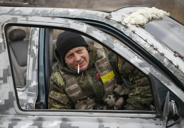 A member of the Ukrainian armed forces is seen near Debaltseve, eastern Ukraine, February 20, 2015. Fighting persisted in east Ukraine on Friday despite new European efforts to ensure a ceasefire takes hold.  REUTERS/Gleb Garanich  (UKRAINE - Tags: POLITICS CIVIL UNREST MILITARY CONFLICT)