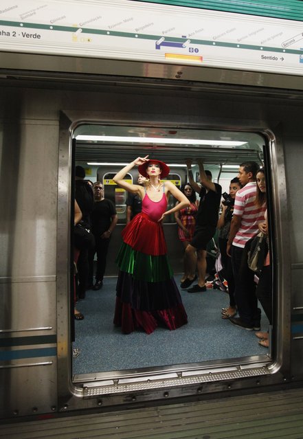 A model presents a creation in a subway station during the Sao Paulo Fashion Week in Sao Paulo October 27, 2013. (Photo by Paulo Whitaker/Reuters)