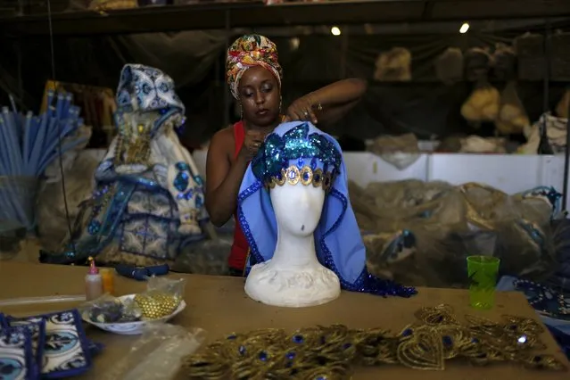 A woman sews a costume at the Grande Rio Samba school in preparation for the annual carnival parade, in Rio de Janeiro, Brazil, January 26, 2016. (Photo by Pilar Olivares/Reuters)