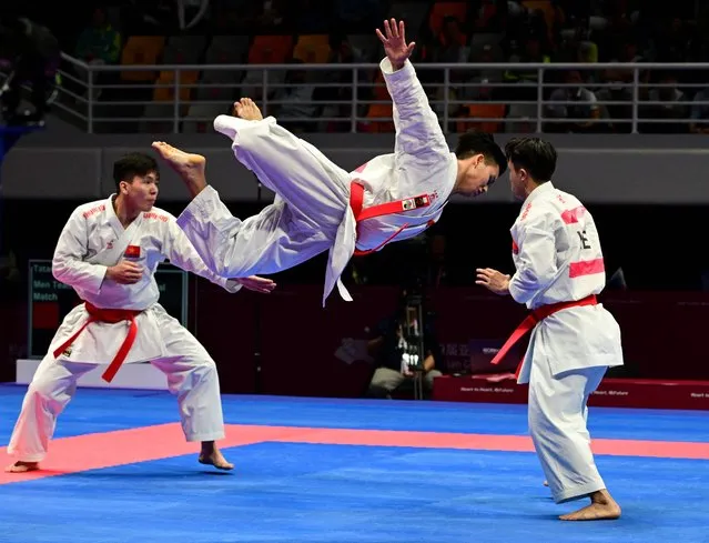 Vietnam's team performs in the men's team Karate event at the Hangzhou 2022 Asian Games in Hangzhou, in China's eastern Zhejiang province on October 8, 2023. (Photo by Ishara S. Kodikara/AFP Photo)