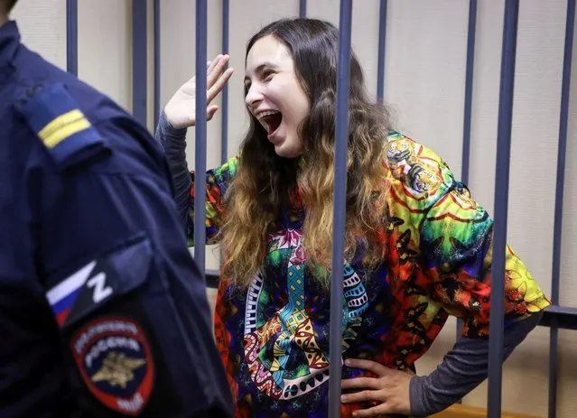 Alexandra (Sasha) Skochilenko, a 33-year-old artist and musician charged with spreading false information about Russia's armed forces after replacing supermarket price tags with slogans protesting against the country's military operation in Ukraine, reacts inside an enclosure for defendants during a court hearing in Saint Petersburg, Russia on November 8, 2023. (Photo by Anton Vaganov/Reuters)