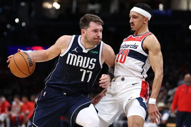 Luka Doncic #77 of the Dallas Mavericks dribbles in front of Landry Shamet #20 of the Washington Wizards during the first half at Capital One Arena on November 15, 2023 in Washington, DC. (Photo by Patrick Smith/Getty Images)