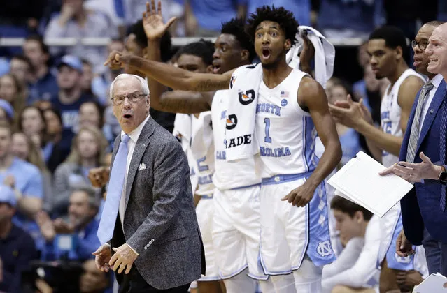 North Carolina head coach Roy Williams reacts with players during the first half of an NCAA college basketball game against Louisville in Chapel Hill, N.C., Saturday, January 12, 2019. (Photo by Gerry Broome/AP Photo)