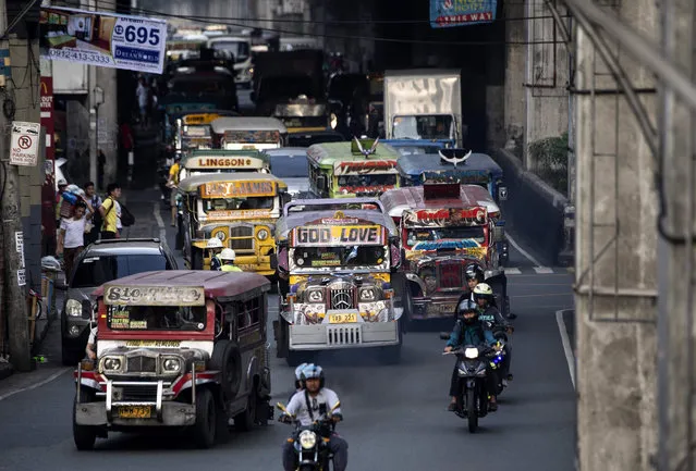 This picture taken on January 17, 2019 shows jeepneys during rush hour in Manila, Philippines. (Photo by Noel Celis/AFP Photo)