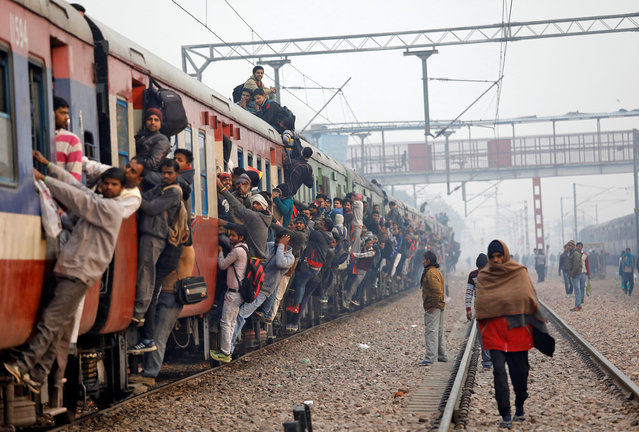 Commuters travel in an overcrowded train near a railway station in Ghaziabad, on the outskirts of New Delhi, India, February 1, 2019. (Photo by Anushree Fadnavis/Reuters)