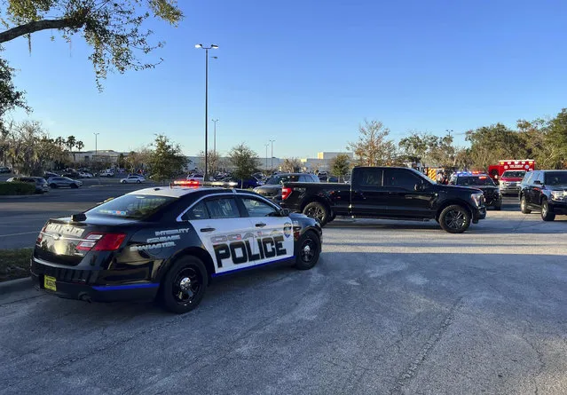 In this photo provided by the Ocala Police Department, a cruiser sits parked following a fatal shooting at Paddock Mall in Ocala, Fla., located about 80 miles northwest of Orlando, Saturday, December 23, 2023. (Photo by Jeff Walczak/Ocala Police Department via AP Photo)