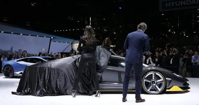 Stephan Winkelmann, President and CEO of Lamborghini, presents the new Lamborghini Centenario, as models unveil the car at the 86th International Motor Show in Geneva, Switzerland, March 1, 2016. (Photo by Denis Balibouse/Reuters)