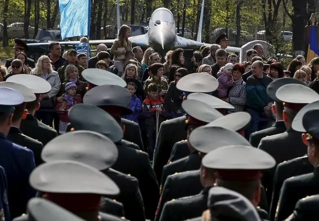 Visitors attend a graduation ceremony at the National University of Defence of Ukraine in Kiev, April 24, 2015. (Photo by Gleb Garanich/Reuters)