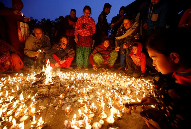 Devotees offer butter lamp to celebrate Shreepanchami festival at Saraswati temple in Kathmandu, Nepal February 1, 2017. (Photo by Navesh Chitrakar/Reuters)