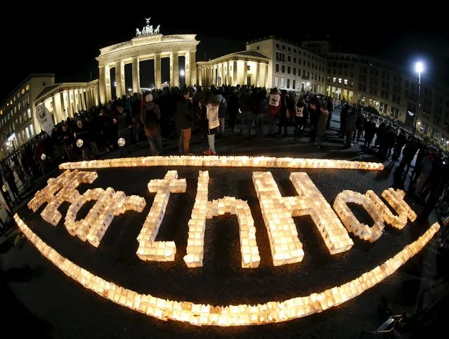 The Brandenburger Tor gate is seen before the Earth Hour in Berlin, Germany March 19, 2016. (Photo by Fabrizio Bensch/Reuters)