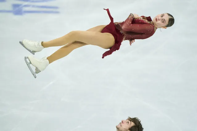 Canada's Kelly Ann Laurin and Loucas Ethier skate their free program in the pairs competition at the International Skating Union (ISU) World Figure Skating Championships in Montreal, Canada, on March 21, 2024. (Photo by Geoff Robins/AFP Photo)