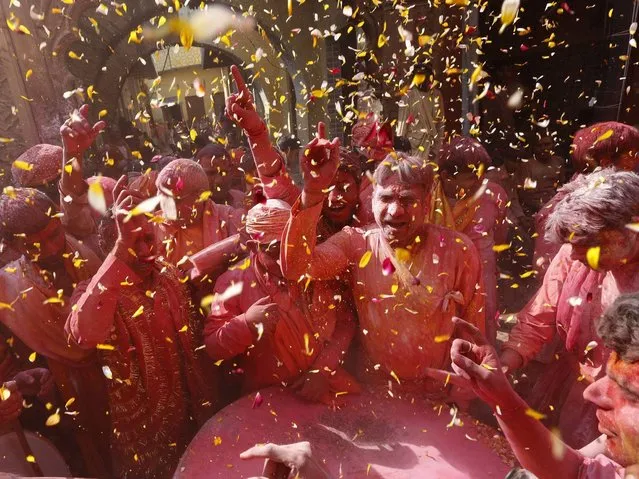 Holi is celebrated at the approach of vernal equinox on the Phalguna Purnima (Full Moon). The festival date varies every year, per the Hindu calendar, and typically comes in March, sometimes February in the Gregorian Calendar. The festival signifies the victory of good over evil, the arrival of spring, end of winter, and for many a festive day to meet others, play and laugh, forget and forgive, and repair ruptured relationships. (Photo by Harish Tyagi/EPA)