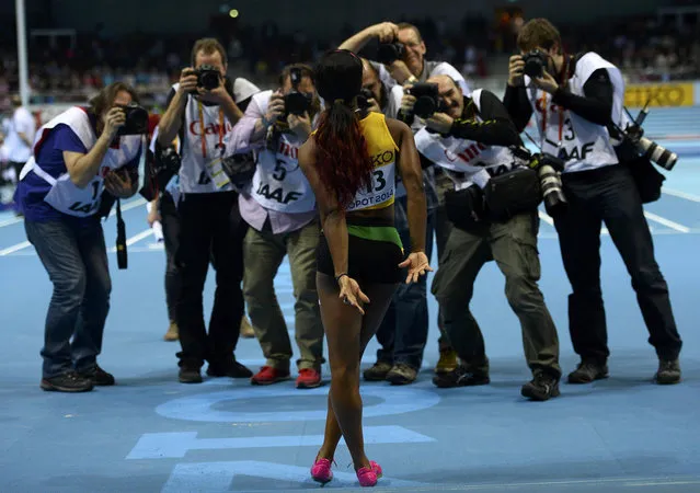 Jamaica's Shelly-Ann Fraser-Pryce poses for photographers after winning the women's 60m final in the world indoor athletics championships at the ERGO Arena in Sopot March 9, 2014. (Photo by Dylan Martinez/Reuters)