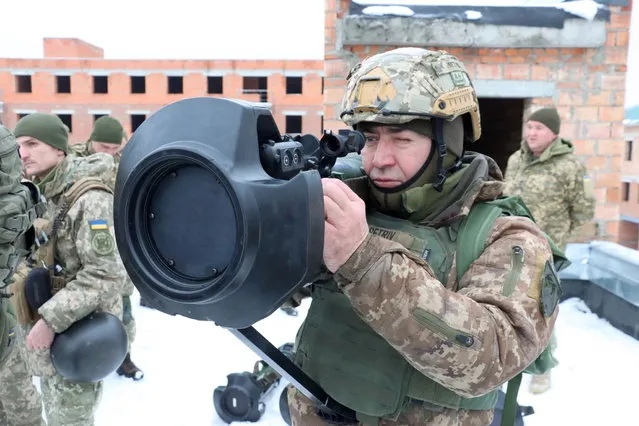 A Ukrainian service member points a next generation light anti-tank weapon (NLAW), supplied by Britain amid tensions between Russia and the West over Ukraine, during drills in the Lviv region, Ukraine, in this handout picture released on January 27, 2022. (Photo by Ukrainian Defence Ministry/Handout via Reuters)