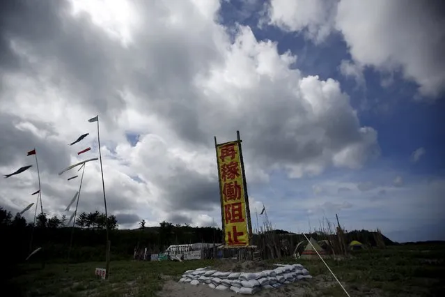 A banner (C) reading “Stop Restart” is displayed at a protesters' camp site near Kyushu Electric Power's Sendai nuclear power station in Satsumasendai, Kagoshima prefecture, Japan, July 8, 2015. (Photo by Issei Kato/Reuters)
