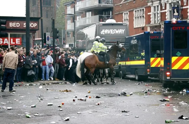 Britain Soccer Football, West Ham United vs Manchester United, Barclays Premier League, Old Trafford on May 10, 2016. General view as bottles are thrown at the Manchester United team bus before the match. (Photo by Eddie Keogh/Reuters/Livepic)