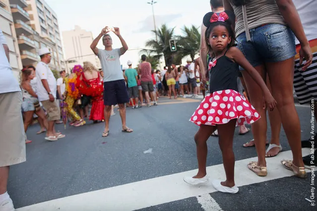 Brazilian revelers gather during Carnival celebrations along Ipanema beach in Rio de Janiero