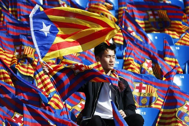 A FC Barcelona fan waves the so-called Estelada flag, Catalunya's separatist unofficial flag, hours before the start of the Spanish King's Cup final between FC Barcelona and Sevilla FC at the Vicente Calderon stadium in Madrid, Spain, 22 May 2016. (Photo by Juan Carlos Hidalgo/EPA)