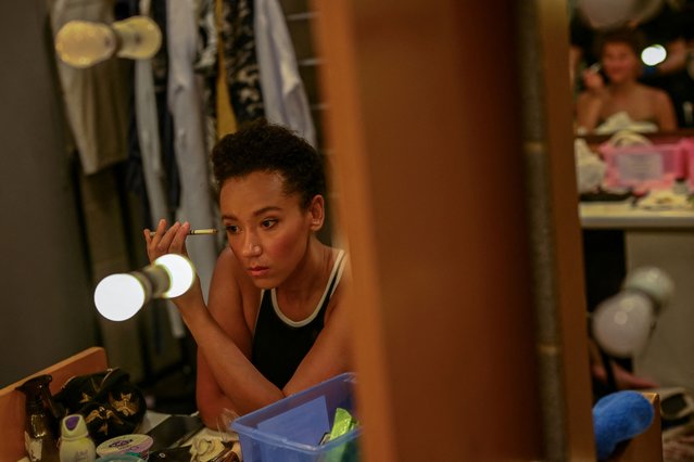 Puppeteer Yana Penrose applies make-up backstage during a break from dress rehearsal for Mozart's “The Magic Flute” at the Glyndebourne Opera Festival in Glynde, Britain, on May 11, 2024. (Photo by Dylan Martinez/Reuters)