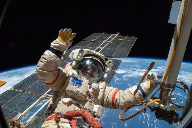 Russian cosmonaut Alexander Skvortsov, Expedition 40 flight engineer, attired in a Russian Orlan spacesuit, participates in a session of extravehicular activity (EVA) in support of science and maintenance on the International Space Station on August 18, 2014. During the five-hour, 11-minute spacewalk, Skvortsov and cosmonaut Oleg Artemyev (out of frame) deployed a small science satellite, retrieved and installed experiment packages and inspected components on the exterior of the orbital laboratory. (Photo by NASA)