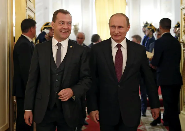 Russian President Vladimir Putin (R) and Prime Minister Dmitry Medvedev attend an award ceremony marking the Day of Russia at the Kremlin in Moscow, Russia, June 12, 2016. (Photo by Dmitry Astakhov/Reuters/Sputnik/Kremlin)