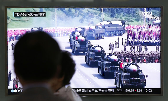 A man watches a TV news program reporting a missile launch of North Korea, at the Seoul Train Station in Seoul, South Korea, Wednesday, June 22, 2016. In a remarkable show of persistence, North Korea on Wednesday fired two suspected powerful new Musudan midrange ballistic missiles, U.S. and South Korean military officials said, its fifth and sixth such attempts since April. The letters read on left top, “North Korea's Musudan flew 400 kilometers (250 miles)”. (Photo by Lee Jin-man/AP Photo)
