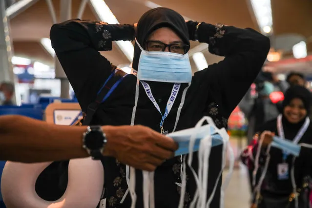 A Malaysian Muslim puts on a protestive mask at the Kuala Lumpur International Airport in Sepang, Malaysia, 04 February 2020. A 41-year-old man from Selangor has become the first Malaysian to be infected by the novel coronavirus (2019-nCoV). “The Malaysian man has a travel history to Singapore and the ministry had contacted the republic for contact tracing”, Health Minister Datuk Seri Dr. Dzulkefly Ahmad said on 04 February. (Photo by Fazry Ismail/EPA/EFE)