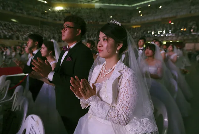 Couples from around the world attend a mass wedding ceremony at the Cheong Shim Peace World Center in Gapyeong, South Korea, Thursday, September 7, 2017. (Photo by Ahn Young-joon/AP Photo)