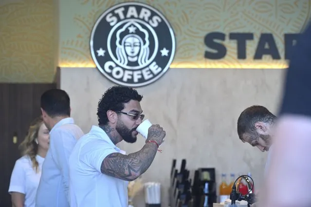 Russian singer and entrepreneur Timur Yunusov, better known as Timati, drinks coffee at a newly opened Stars Coffee coffee shop in the former location of the Starbucks coffee shop in Moscow, Russia, Thursday, August 18, 2022. A new chain of coffee shops opens Thursday in Moscow, after Russian singer and entrepreneur Timur Yunusov, better known as Timati, together with Russian restaurateur Anton Pinskiy bought the Starbucks stores following company's withdrawal from Russia. (Photo by Dmitry Serebryakov/AP Photo)