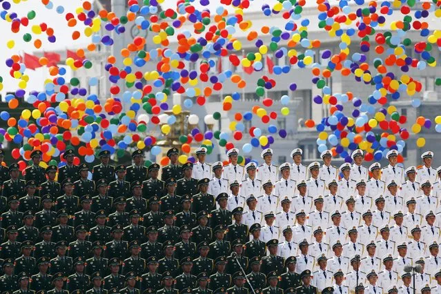 Colourful balloons are released at the end of the military parade marking the 70th anniversary of the end of World War Two, in Beijing, China, September 3, 2015. (Photo by Damir Sagolj/Reuters)