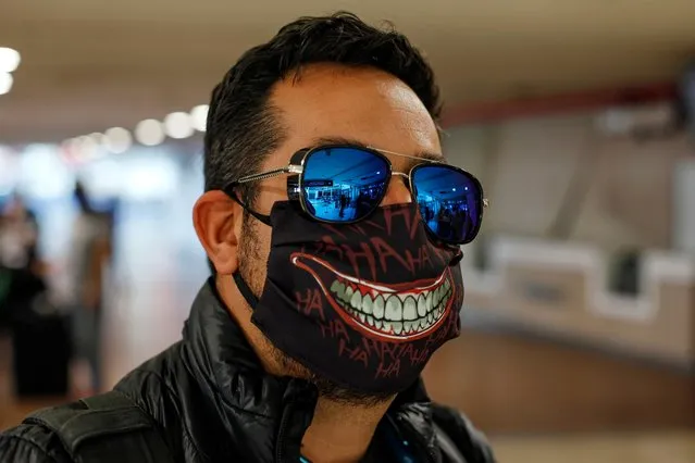 A man wears a protective mask as a preventive measure against the coronavirus disease (COVID-19)  at Arturo Merino Benitez International Airport in Santiago, Chile on April 25, 2020. (Photo by Lucas Alvarado/Reuters)