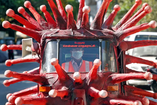 A man drives an auto-rickshaw depicting the coronavirus to create awareness about staying at home during a nationwide lockdown to slow the spreading of the coronavirus disease (COVID-19), in Chennai, India, April 23, 2020. (Photo by P. Ravikumar/Reuters)
