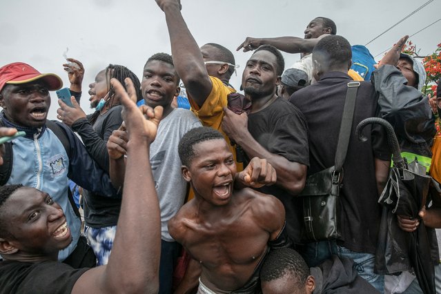 Supporters of Mozambique's main opposition leader Venancio Mondlane celebrate in Maputo on January 9, 2025, following the return of Mandlane to Mozambique. Mozambique's main opposition leader returned from more than two months in exile on January 9, 2025 saying he was ready to take part in talks over disputed election results that have led to weeks of deadly protests Mondlane, who claims the October 9 election was stolen from him, arrived at Maputo's main airport from an unknown location and was greeted by a large crowd of journalists He had called on his supporters to meet him on arrival but security forces restricted access to the airport. (Photo by Alfredo Zuniga/AFP Photo)