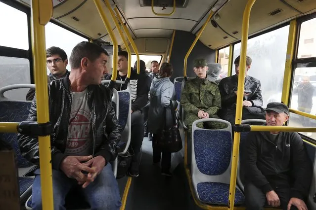 Russian recruits sit inside a bus near a military recruitment center in Volgograd, Russia, Saturday, September 24, 2022. (Photo by AP Photo/Stringer)