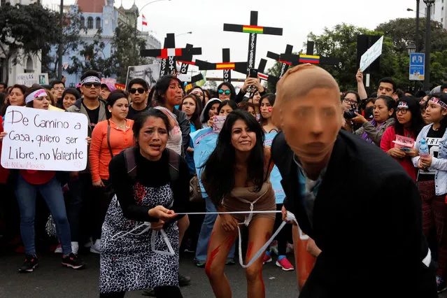 People take part in a protest against violence against women in Lima, August 13, 2016. (Photo by Guadalupe Pardo/Reuters)