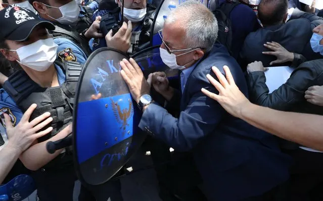Turkish riot police confront lawmakers of the Kurdish People's Democtaric Party (HDP) during a protest against the arrest of HDP parliamentarians Leyla Guven and Musa Farisogullari, in Ankara, Turkey, 05 June 2020. The opposition politicians were stripped their parliamentary seats and taken into custody. (Photo by EPA/EFE/Stringer)
