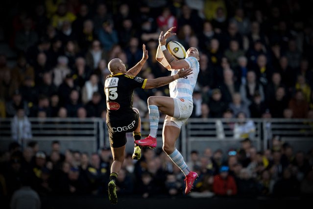 La Rochelle's French wing Teddy Thomas (L) and Racing92's French centre Gael Fickou jump for the ball during the French Top14 rugby union match between Stade Rochelais (La Rochelle) and Racing 92 at the Marcel-Deflandre Stadium in La Rochelle, western France on February 22, 2025. (Photo by Xavier Leoty/AFP Photo)