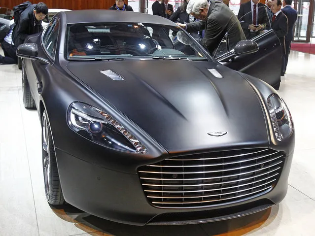 An Aston Martin Rapide S is presented at the Paris Motor Show on October 2, 2014. (Photo by Remy de la Mauviniere/AP Photo)