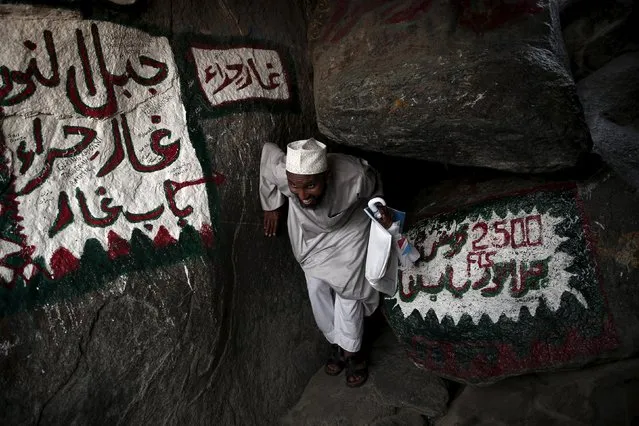 A Muslim pilgrim makes his way to Hera cave, where Muslims believe Prophet Mohammad received the first words of the Koran through Gabriel, at the top of Mount Al-Noor during the annual haj pilgrimage in the holy city of Mecca, September 21, 2015. (Photo by Ahmad Masood/Reuters)