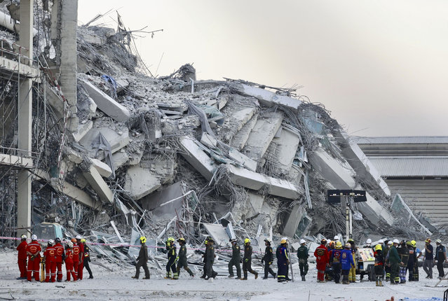 Rescuers work at the site a high-rise building under construction that collapsed after a 7.7 magnitude earthquake in Bangkok, Thailand, Friday, March 28, 2025. (Photo by Wason Wanichakorn/AP Photo)