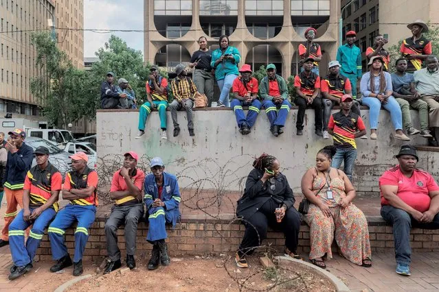 Members of the South African Municipal Workers' Union (SAMWU) gather during a strike over wage increases in Beyers Naude Square, Johannesburg, on November 10, 2022. (Photo by Luca Sola/AFP Photo)