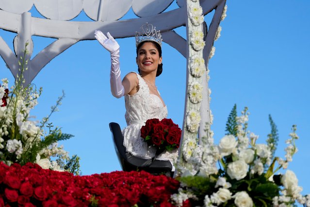 Rose Queen Naomi Stillitano waves to the crowd at the 135th Rose Parade in Pasadena, Calif., Monday, January 1, 2024. (Photo by Jae C. Hong/AP Photo)