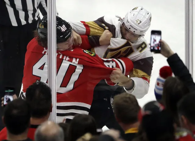 Chicago Blackhawks right wing John Hayden, left, and Vegas Golden Knights defenseman Luca Sbisa fight during the second period of an NHL hockey game Friday, January 5, 2018, in Chicago. (Photo by Nam Y. Huh/AP Photo)