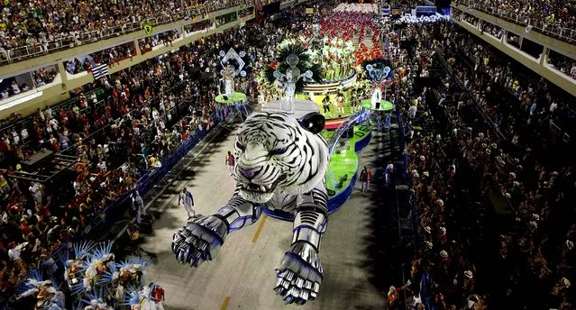 Performers from the Inocentes de Belford Roxo samba school parade during carnival celebrations at the Sambadrome in Rio de Janeiro.  (Photo by Felipe Dana/Associated Press)